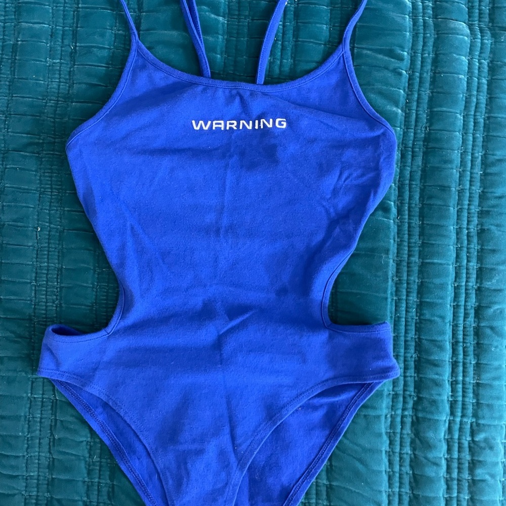 Forever 21 sexy cut-out bodysuit. Wore once. Size medium. Clasp bottom.